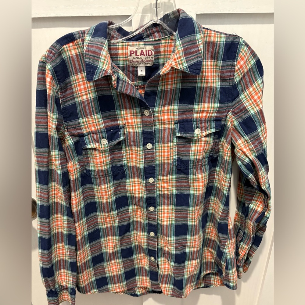Women’s navy and orange plaid flannel.